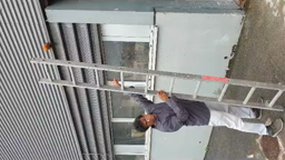 Using a ladder.